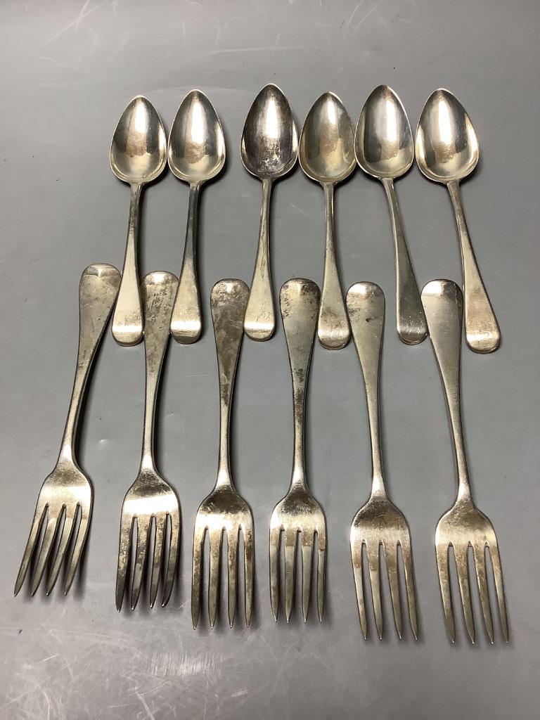 A set of six George III Old English silver dessert spoons, London 1805, Samuel Godbehere, Edward Wigan & James Boult and six Victorian Old English silver dinner forks, approximately 18oz